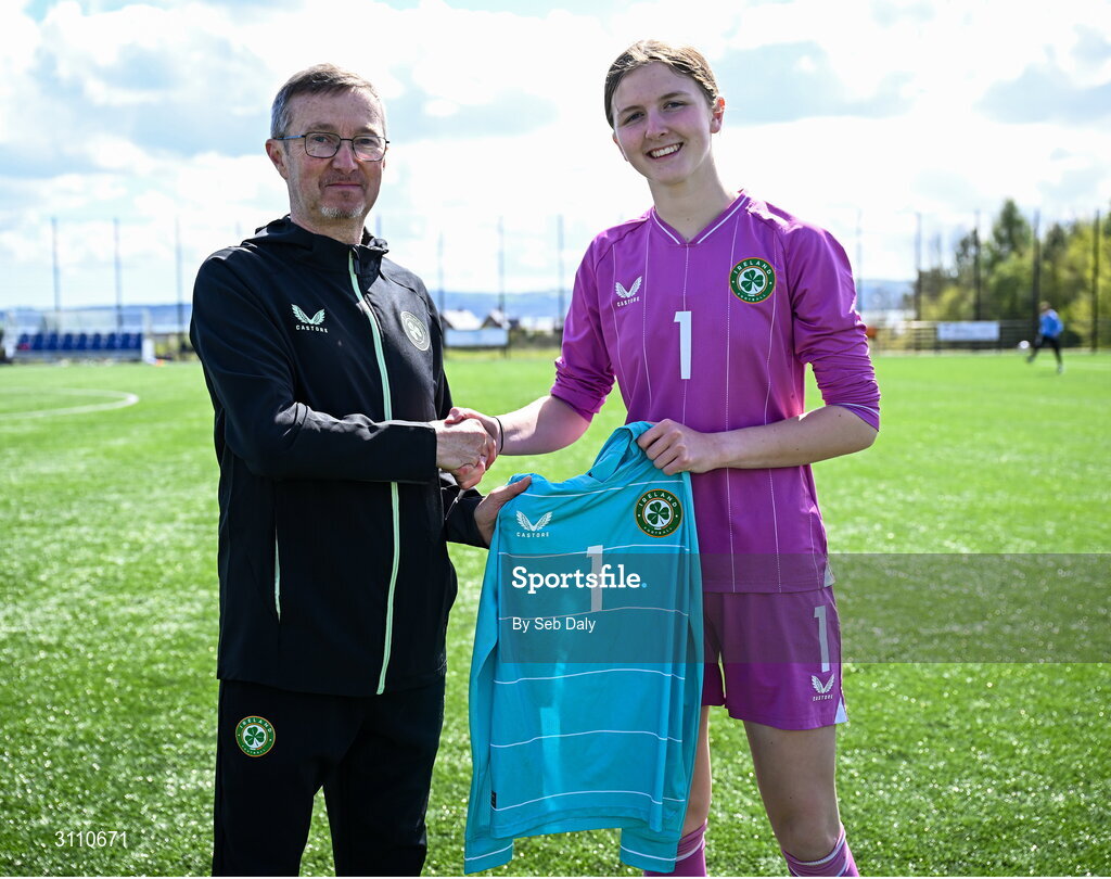 17 April 2025; Republic of Ireland goalkeeper Sarah Doyle is presented with her jersey by Republic of Ireland head coach Richard Berkeley after the Girls U15 SAFIB Bob Docherty Cup match between Northern Ireland and Republic of Ireland at Greenisland FC in Antrim. Photo by Seb Daly/Sportsfile