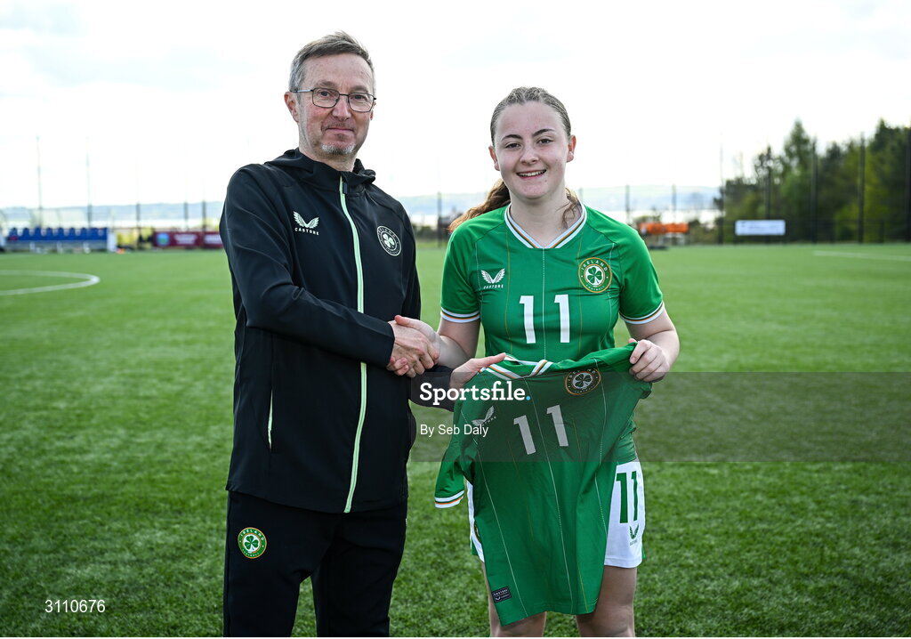 17 April 2025; Abbie Duffy of Republic of Ireland is presented with her jersey by Republic of Ireland head coach Richard Berkeley after the Girls U15 SAFIB Bob Docherty Cup match between Northern Ireland and Republic of Ireland at Greenisland FC in Antrim. Photo by Seb Daly/Sportsfile