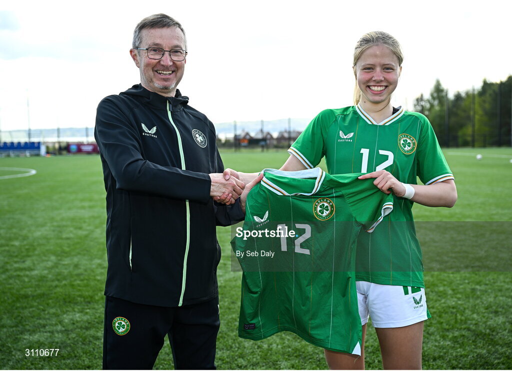 17 April 2025; Matylda Stelmaszek of Republic of Ireland is presented with her jersey by Republic of Ireland head coach Richard Berkeley after the Girls U15 SAFIB Bob Docherty Cup match between Northern Ireland and Republic of Ireland at Greenisland FC in Antrim. Photo by Seb Daly/Sportsfile