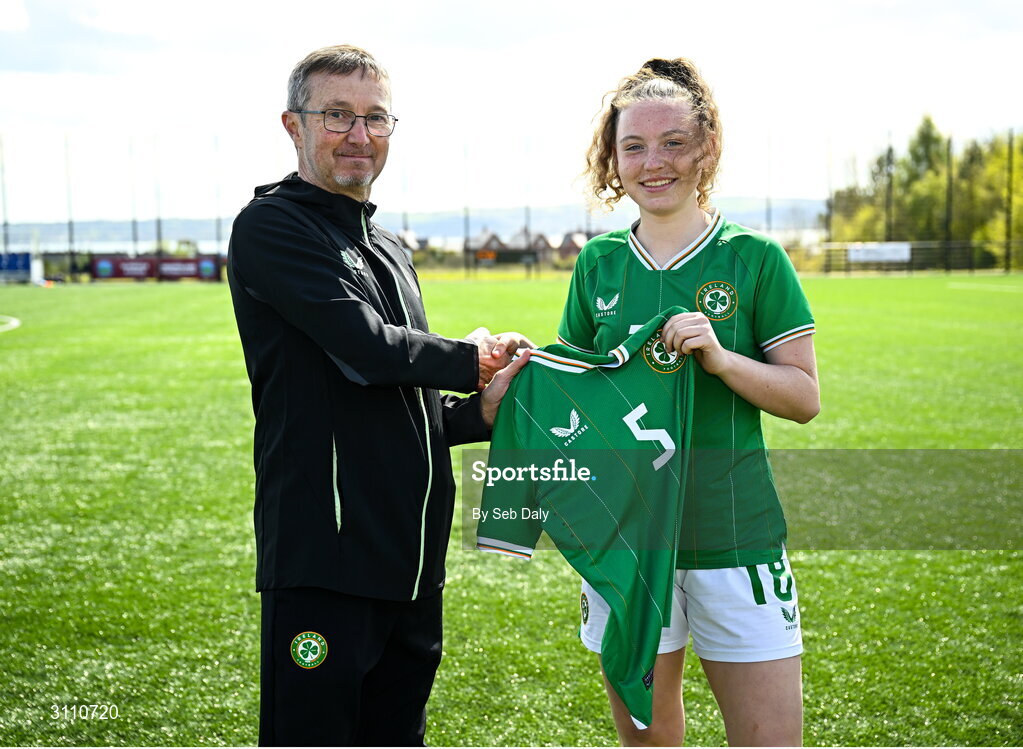 17 April 2025; Laila Hurley of Republic of Ireland is presented with her jersey by Republic of Ireland head coach Richard Berkeley after the Girls U15 SAFIB Bob Docherty Cup match between Northern Ireland and Republic of Ireland at Greenisland FC in Antrim. Photo by Seb Daly/Sportsfile