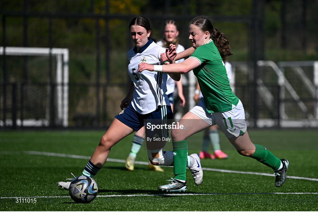 17 April 2025; Abbie Duffy of Republic of Ireland in action against Ellie-Mae Turner of Northern Ireland during the Girls U15 SAFIB Bob Docherty Cup match between Northern Ireland and Republic of Ireland at Greenisland FC in Antrim. Photo by Seb Daly/Sportsfile