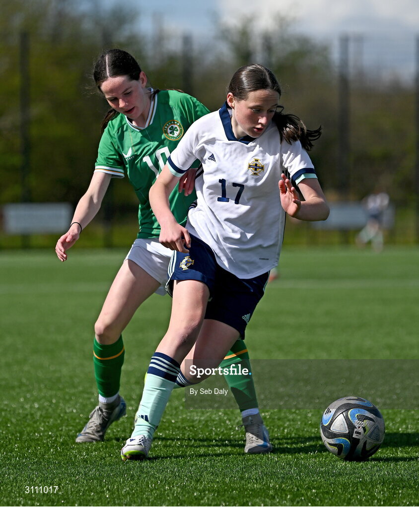 17 April 2025; Grace Murray of Northern Ireland in action against Ellen Goggin of Republic of Ireland during the Girls U15 SAFIB Bob Docherty Cup match between Northern Ireland and Republic of Ireland at Greenisland FC in Antrim. Photo by Seb Daly/Sportsfile