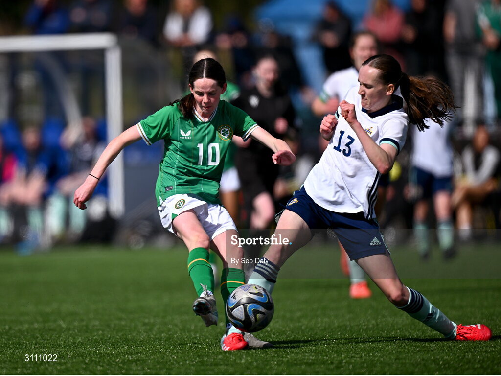 17 April 2025; Ellen Goggin of Republic of Ireland in action against Sara Devany of Northern Ireland during the Girls U15 SAFIB Bob Docherty Cup match between Northern Ireland and Republic of Ireland at Greenisland FC in Antrim. Photo by Seb Daly/Sportsfile