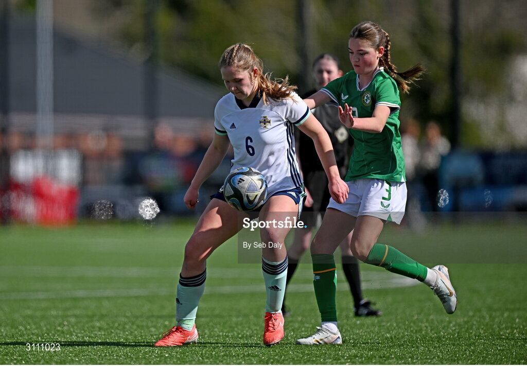17 April 2025; Grace Guest of Northern Ireland in action against Ava Hallinan of Republic of Ireland during the Girls U15 SAFIB Bob Docherty Cup match between Northern Ireland and Republic of Ireland at Greenisland FC in Antrim. Photo by Seb Daly/Sportsfile