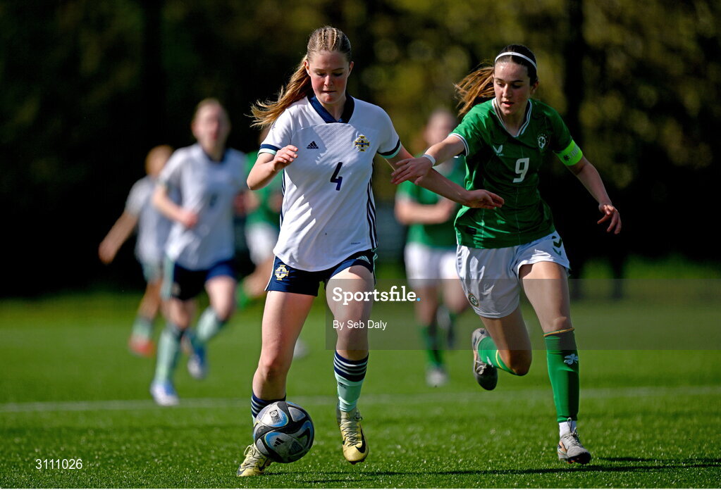17 April 2025; Sasha Cowan of Northern Ireland in action against Ciara Milton of Republic of Ireland during the Girls U15 SAFIB Bob Docherty Cup match between Northern Ireland and Republic of Ireland at Greenisland FC in Antrim. Photo by Seb Daly/Sportsfile