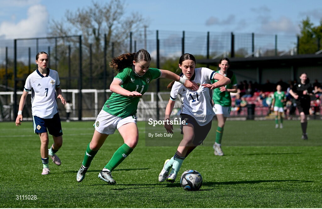 17 April 2025; Abbie Duffy of Republic of Ireland in action against Grace Murray of Northern Ireland during the Girls U15 SAFIB Bob Docherty Cup match between Northern Ireland and Republic of Ireland at Greenisland FC in Antrim. Photo by Seb Daly/Sportsfile