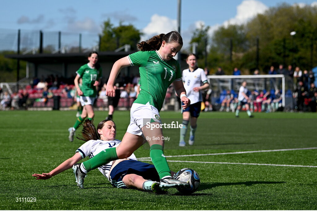 17 April 2025; Abbie Duffy of Republic of Ireland in action against Grace Murray of Northern Ireland during the Girls U15 SAFIB Bob Docherty Cup match between Northern Ireland and Republic of Ireland at Greenisland FC in Antrim. Photo by Seb Daly/Sportsfile
