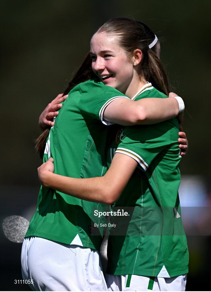 17 April 2025; Hailey Twomey of Republic of Ireland, right, celebrates with teammate Ciara Milton after scoring their side's second goal during the Girls U15 SAFIB Bob Docherty Cup match between Northern Ireland and Republic of Ireland at Greenisland FC in Antrim. Photo by Seb Daly/Sportsfile