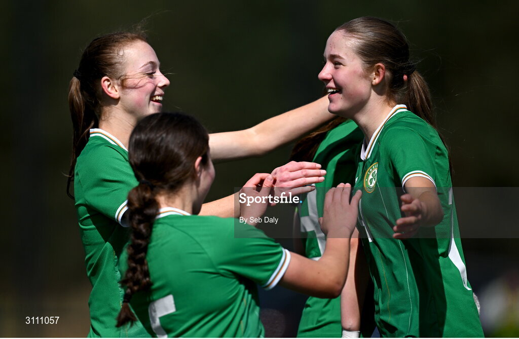 17 April 2025; Hailey Twomey of Republic of Ireland, right, celebrates with teammates Ruby Norris, left, and Lara Dallaghan after scoring their side's second goal during the Girls U15 SAFIB Bob Docherty Cup match between Northern Ireland and Republic of Ireland at Greenisland FC in Antrim. Photo by Seb Daly/Sportsfile