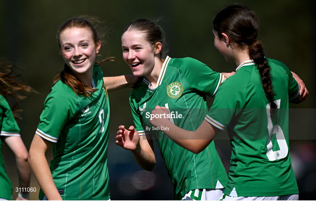 17 April 2025; Hailey Twomey of Republic of Ireland, centre, celebrates with teammates Ruby Norris, left, and Lara Dallaghan after scoring their side's second goal during the Girls U15 SAFIB Bob Docherty Cup match between Northern Ireland and Republic of Ireland at Greenisland FC in Antrim. Photo by Seb Daly/Sportsfile