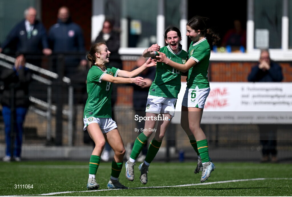 17 April 2025; Ellen Goggin of Republic of Ireland, centre, celebrates with teammates Ruby Norris, left, and Lara Dallaghan after scoring their side's third goal during the Girls U15 SAFIB Bob Docherty Cup match between Northern Ireland and Republic of Ireland at Greenisland FC in Antrim. Photo by Seb Daly/Sportsfile