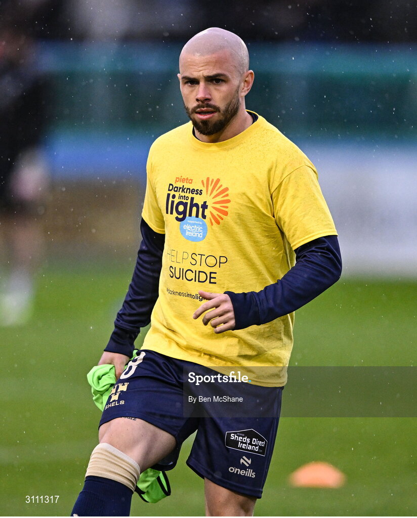 18 April 2025; Mark Coyle of Shelbourne wears a 'Darkness into light' t-shirt during the warm-ups before the SSE Airtricity Men's Premier Division match between Drogheda United and Shelbourne at Sullivan & Lambe Park in Drogheda, Louth. Photo by Ben McShane/Sportsfile