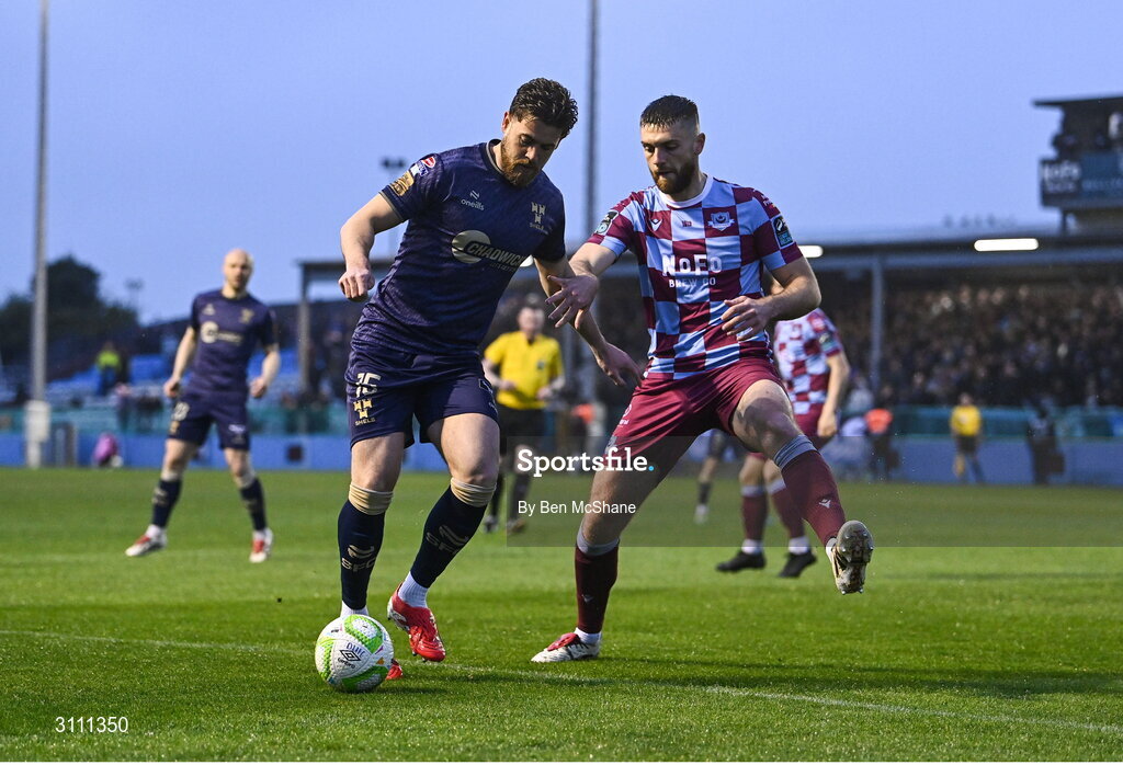 18 April 2025; Sam Bone of Shelbourne in action against Conor Keeley of Drogheda United during the SSE Airtricity Men's Premier Division match between Drogheda United and Shelbourne at Sullivan & Lambe Park in Drogheda, Louth. Photo by Ben McShane/Sportsfile