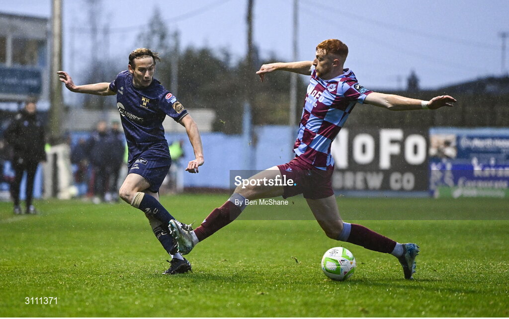 18 April 2025; Harry Wood of Shelbourne in action against James Bolger of Drogheda United during the SSE Airtricity Men's Premier Division match between Drogheda United and Shelbourne at Sullivan & Lambe Park in Drogheda, Louth. Photo by Ben McShane/Sportsfile