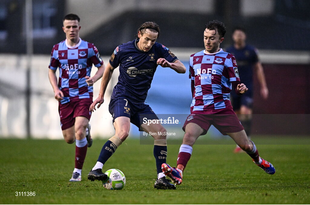 18 April 2025; Harry Wood of Shelbourne in action against Darragh Markey of Drogheda United during the SSE Airtricity Men's Premier Division match between Drogheda United and Shelbourne at Sullivan & Lambe Park in Drogheda, Louth. Photo by Ben McShane/Sportsfile