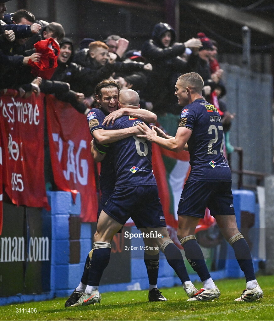 18 April 2025; Mark Coyle of Shelbourne, centre, celebrates with team-mate Harry Wood, left, and Evan Caffrey after scoring their side's first goal during the SSE Airtricity Men's Premier Division match between Drogheda United and Shelbourne at Sullivan & Lambe Park in Drogheda, Louth. Photo by Ben McShane/Sportsfile