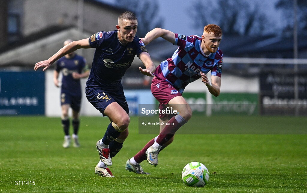 18 April 2025; Evan Caffrey of Shelbourne in action against James Bolger of Drogheda United during the SSE Airtricity Men's Premier Division match between Drogheda United and Shelbourne at Sullivan & Lambe Park in Drogheda, Louth. Photo by Ben McShane/Sportsfile