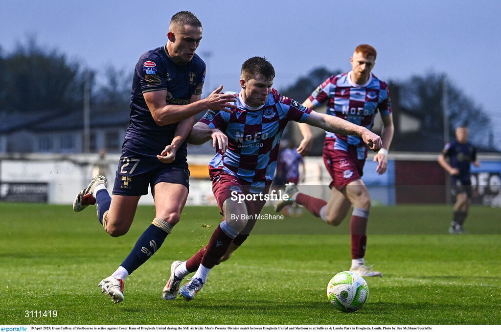 18 April 2025; Evan Caffrey of Shelbourne in action against Conor Kane of Drogheda United during the SSE Airtricity Men's Premier Division match between Drogheda United and Shelbourne at Sullivan & Lambe Park in Drogheda, Louth. Photo by Ben McShane/Sportsfile