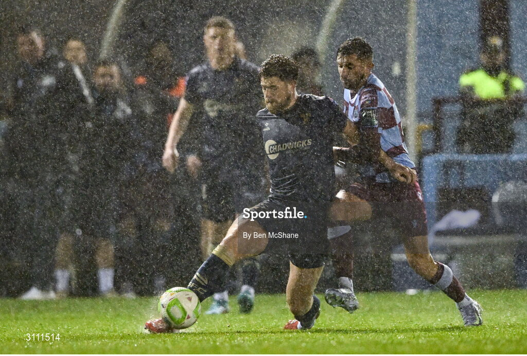 18 April 2025; Sam Bone of Shelbourne in action against Luke Heeney of Drogheda United during the SSE Airtricity Men's Premier Division match between Drogheda United and Shelbourne at Sullivan & Lambe Park in Drogheda, Louth. Photo by Ben McShane/Sportsfile