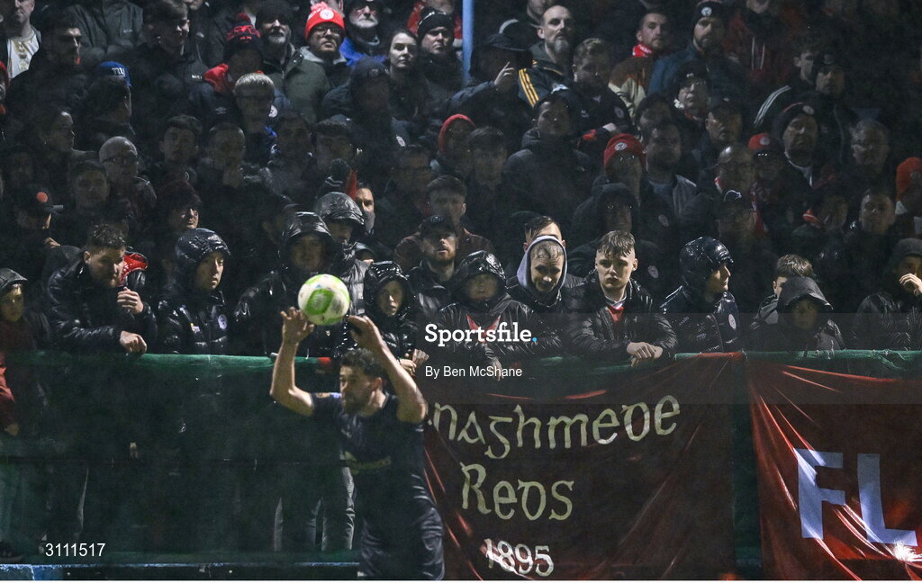 18 April 2025; Shelbourne supporters watch on as Sam Bone of Shelbourne takes a throw-in during the SSE Airtricity Men's Premier Division match between Drogheda United and Shelbourne at Sullivan & Lambe Park in Drogheda, Louth. Photo by Ben McShane/Sportsfile