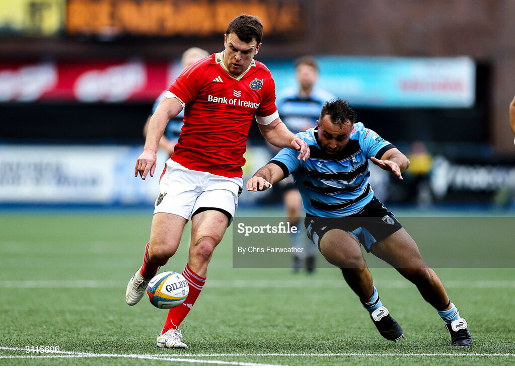 25 April 2025; Tom Farrell of Munster and Liam Belcher of Cardiff go for the ball during the United Rugby Championship match between Cardiff and Munster at Cardiff Arms Park in Cardiff, Wales. Photo by Chris Fairweather/Sportsfile