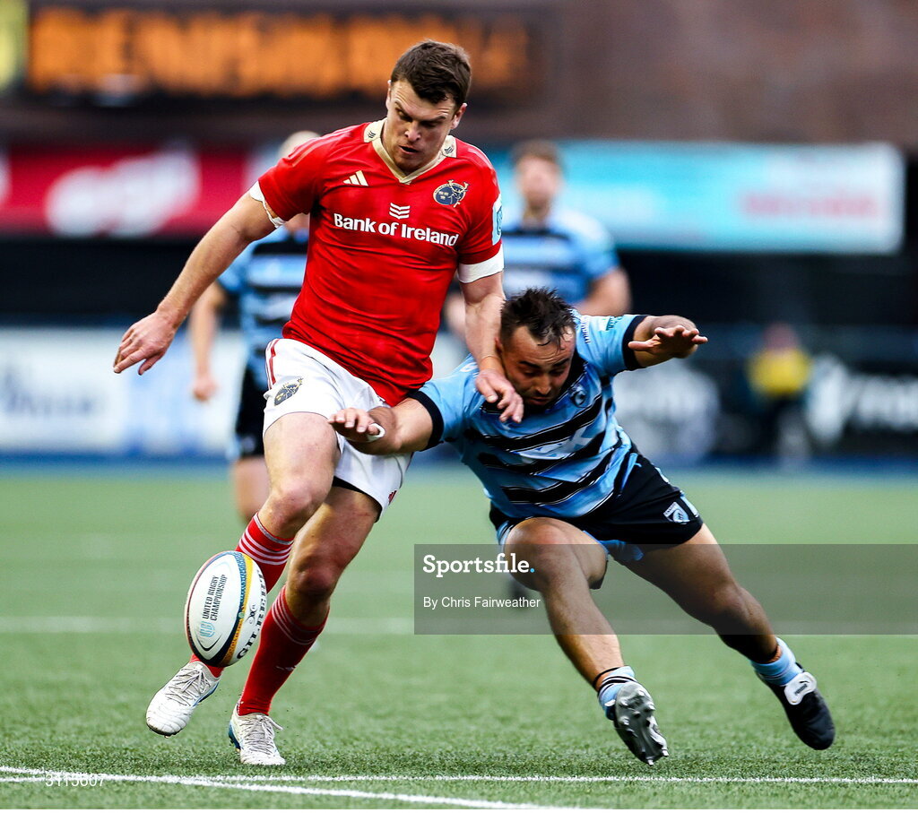25 April 2025; Tom Farrell of Munster and Liam Belcher of Cardiff go for the ball during the United Rugby Championship match between Cardiff and Munster at Cardiff Arms Park in Cardiff, Wales. Photo by Chris Fairweather/Sportsfile