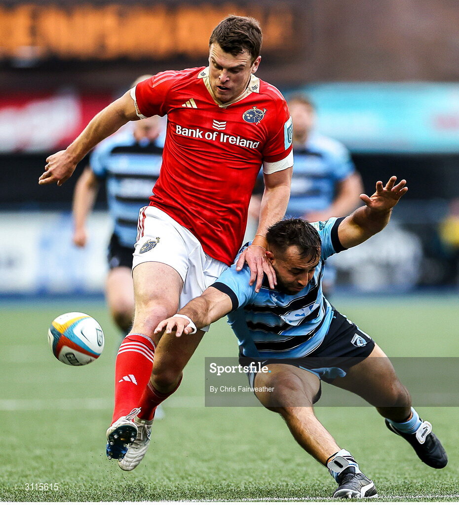25 April 2025; Tom Farrell of Munster and Liam Belcher of Cardiff go for the ball during the United Rugby Championship match between Cardiff and Munster at Cardiff Arms Park in Cardiff, Wales. Photo by Chris Fairweather/Sportsfile
