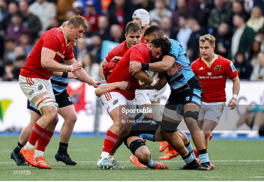 25 April 2025; Michael Milne of Munster is tackled by Taulupe Faletau of Cardiff during the United Rugby Championship match between Cardiff and Munster at Cardiff Arms Park in Cardiff, Wales. Photo by Chris Fairweather/Sportsfile