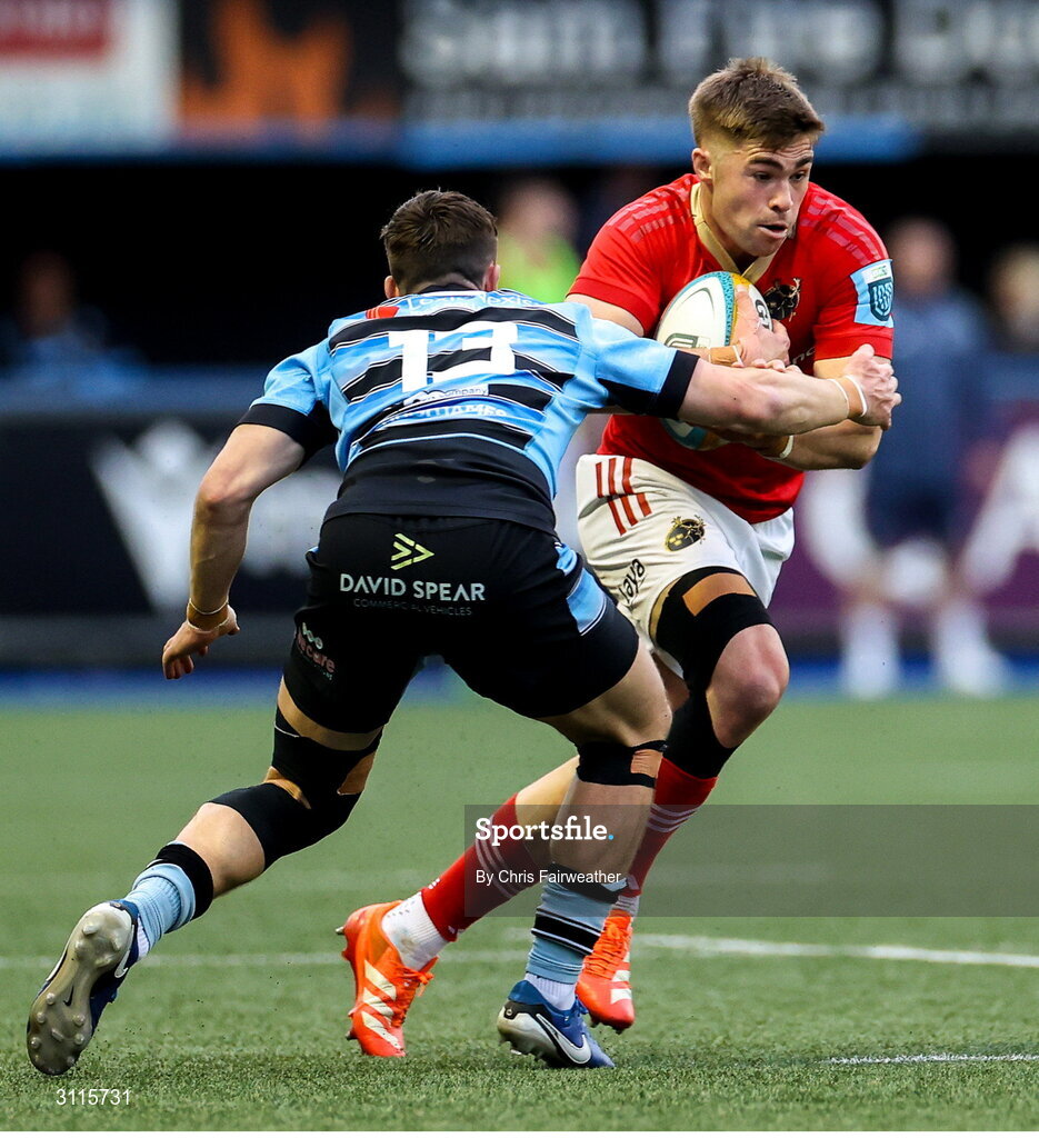 25 April 2025; Jack Crowley of Munster is tackled by Harri Millard of Cardiff during the United Rugby Championship match between Cardiff and Munster at Cardiff Arms Park in Cardiff, Wales. Photo by Chris Fairweather/Sportsfile
