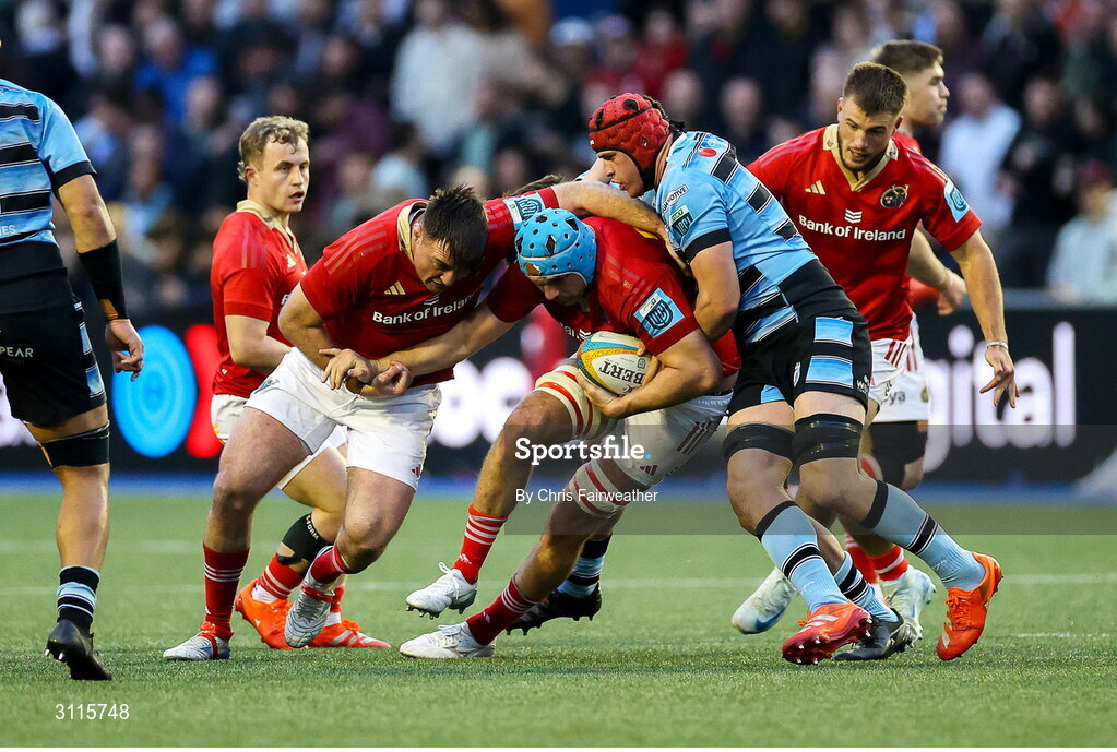 25 April 2025; Tadhg Beirne of Munster is tackled by James Botham of Cardiff during the United Rugby Championship match between Cardiff and Munster at Cardiff Arms Park in Cardiff, Wales. Photo by Chris Fairweather/Sportsfile