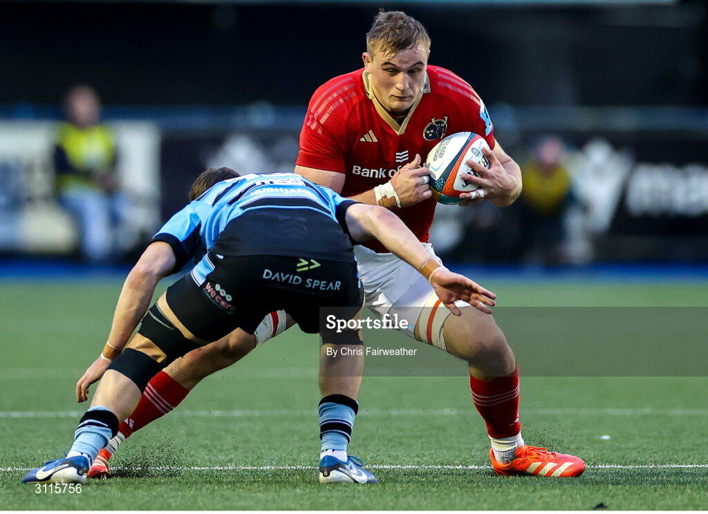25 April 2025; Gavin Coombes of Munster is tackled by Harri Millard of Cardiff during the United Rugby Championship match between Cardiff and Munster at Cardiff Arms Park in Cardiff, Wales. Photo by Chris Fairweather/Sportsfile