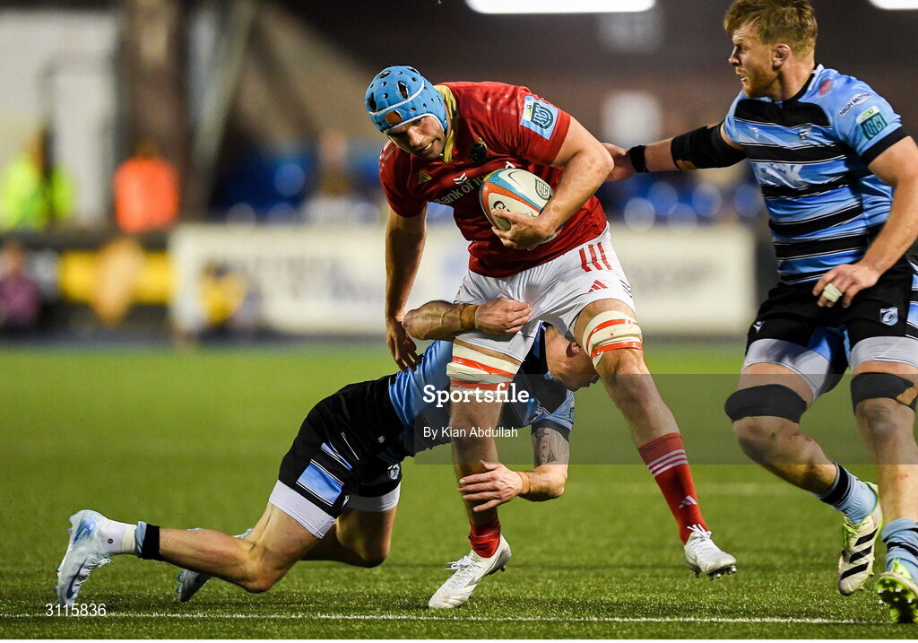 25 April 2025; Tadhg Beirne of Munster is challenged by Josh Adams of Cardiff during the United Rugby Championship match between Cardiff and Munster at Cardiff Arms Park in Cardiff, Wales. Photo by Kian Abdullah/Sportsfile