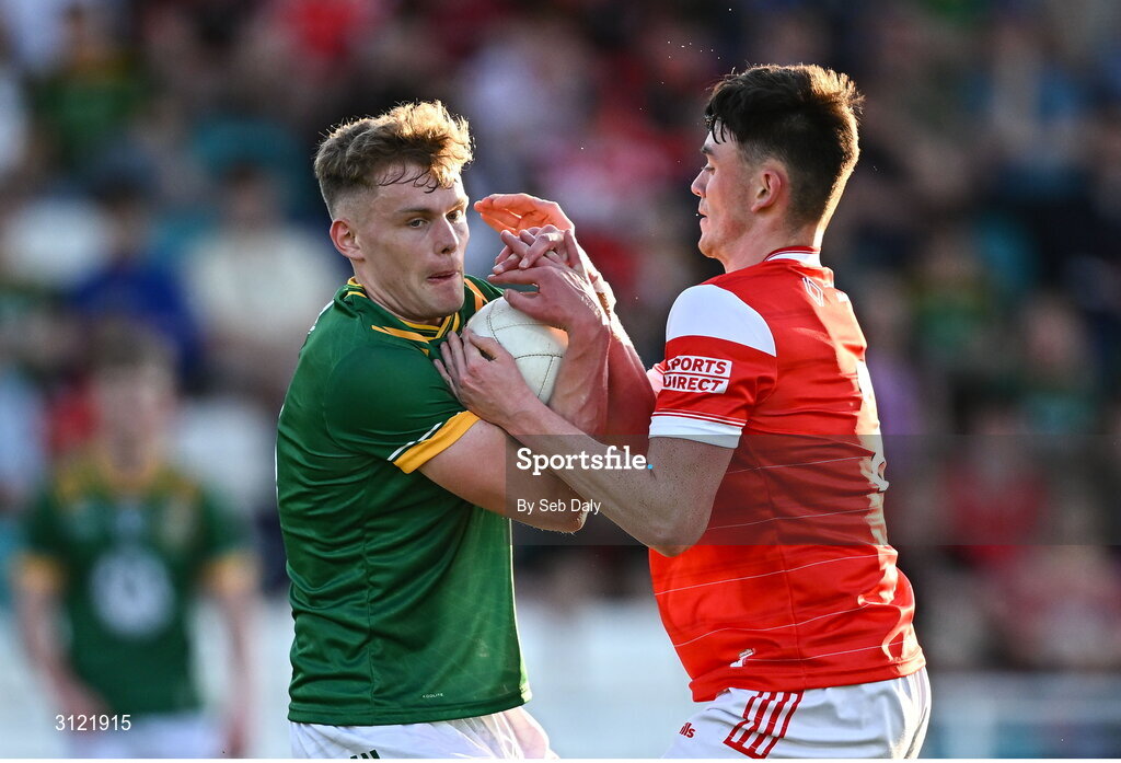 30 April 2025; Tadgh Martyn of Meath in action against Michéal Reid of Louth during the Dalata Hotel Group Leinster GAA Football U20 Championship final match between Meath and Louth at Cedral St Conleth’s Park in Newbridge, Kildare. Photo by Seb Daly/Sportsfile