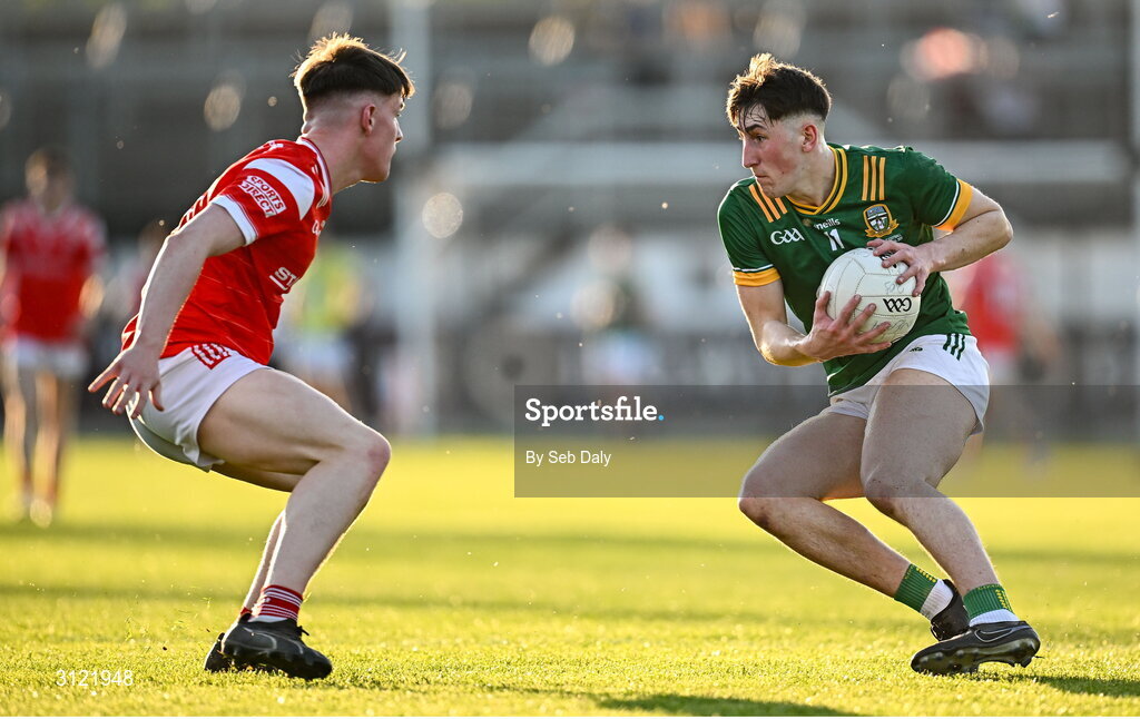 30 April 2025; John Harkin of Meath in action against Conor McGinty of Louth during the Dalata Hotel Group Leinster GAA Football U20 Championship final match between Meath and Louth at Cedral St Conleth’s Park in Newbridge, Kildare. Photo by Seb Daly/Sportsfile