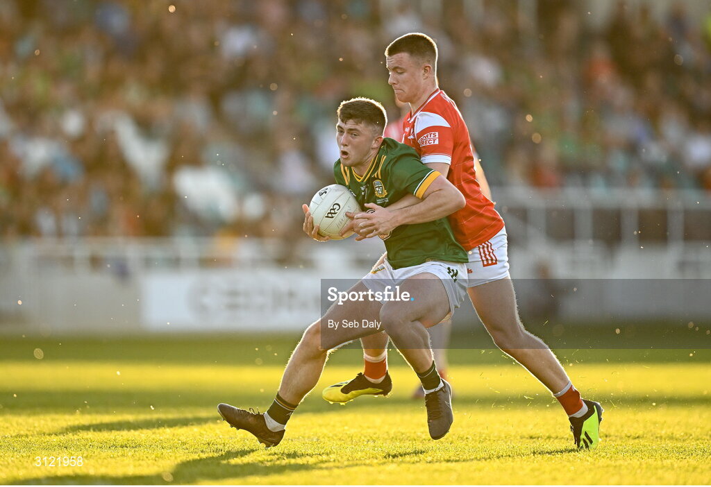 30 April 2025; Finn White of Meath in action against Conor Mac Croista of Louth during the Dalata Hotel Group Leinster GAA Football U20 Championship final match between Meath and Louth at Cedral St Conleth’s Park in Newbridge, Kildare. Photo by Seb Daly/Sportsfile