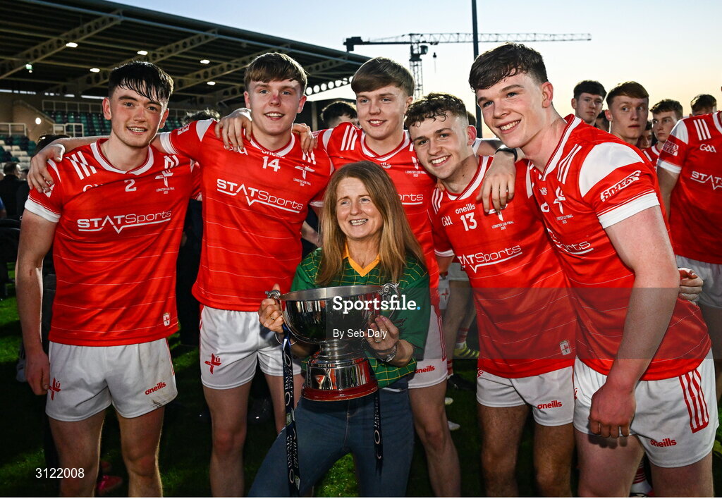 30 April 2025; Louth players, from left, Michéal Reid, Dylan Shelvin, Ryan Shevlin, Adam Gillespie and Keelin Martin celebrate with their teacher Bridget Smith, head of sixth year at Ardee Community School, after the Dalata Hotel Group Leinster GAA Football U20 Championship final match between Meath and Louth at Cedral St Conleth’s Park in Newbridge, Kildare. Photo by Seb Daly/Sportsfile