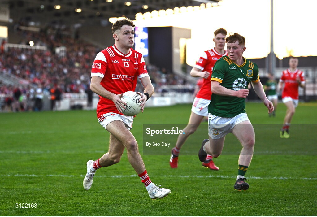 30 April 2025; Adam Gillespie of Louth in action against Ciarán O’Hare of Meath during the Dalata Hotel Group Leinster GAA Football U20 Championship final match between Meath and Louth at Cedral St Conleth’s Park in Newbridge, Kildare. Photo by Seb Daly/Sportsfile