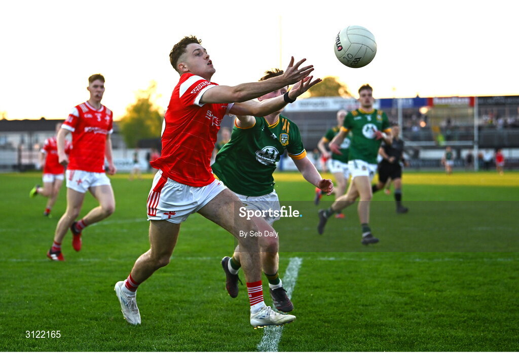30 April 2025; Adam Gillespie of Louth in action against Ciarán O’Hare of Meath during the Dalata Hotel Group Leinster GAA Football U20 Championship final match between Meath and Louth at Cedral St Conleth’s Park in Newbridge, Kildare. Photo by Seb Daly/Sportsfile