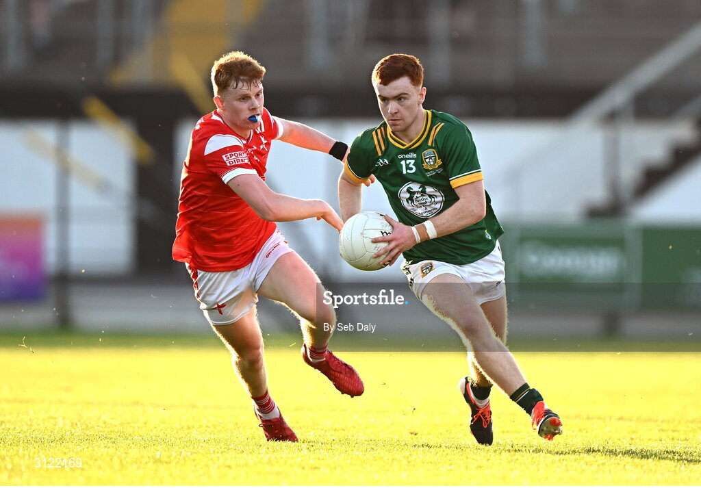 30 April 2025; Ben Corkery of Meath in action against Padric Tinnelly of Louth during the Dalata Hotel Group Leinster GAA Football U20 Championship final match between Meath and Louth at Cedral St Conleth’s Park in Newbridge, Kildare. Photo by Seb Daly/Sportsfile
