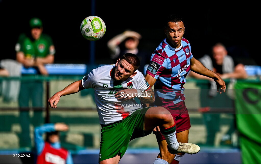 5 May 2025; Douglas James-Taylor of Drogheda United heads on goal despite pressure from Sean Murray of Cork City during the SSE Airtricity Men's Premier Division match between Drogheda United and Cork City at Sullivan & Lambe Park in Drogheda, Louth. Photo by Tyler Miller/Sportsfile