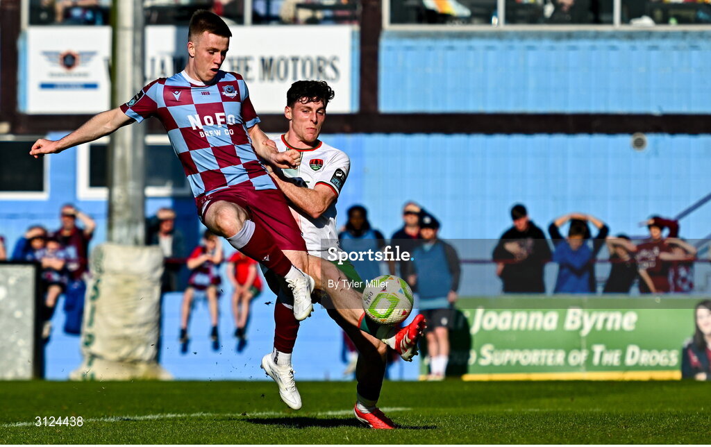 5 May 2025; Warren Davis of Drogheda United shoots to score his side's second goal despite the efforts of Harry Nevin of Cork City during the SSE Airtricity Men's Premier Division match between Drogheda United and Cork City at Sullivan & Lambe Park in Drogheda, Louth. Photo by Tyler Miller/Sportsfile