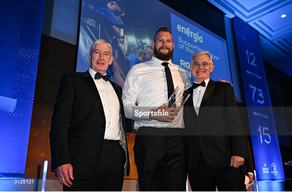 6 May 2025; RG Snyman is presented with the Energia Supporters Player of the Year award by Gary Ryan, Managing Director, Customer Solutions, Energia, right, and Leinster Rugby president Declan Gardiner during the Leinster Rugby awards ball 2025 at O'Reilly Hall in UCD, Dublin. Photo by Brendan Moran/Sportsfile