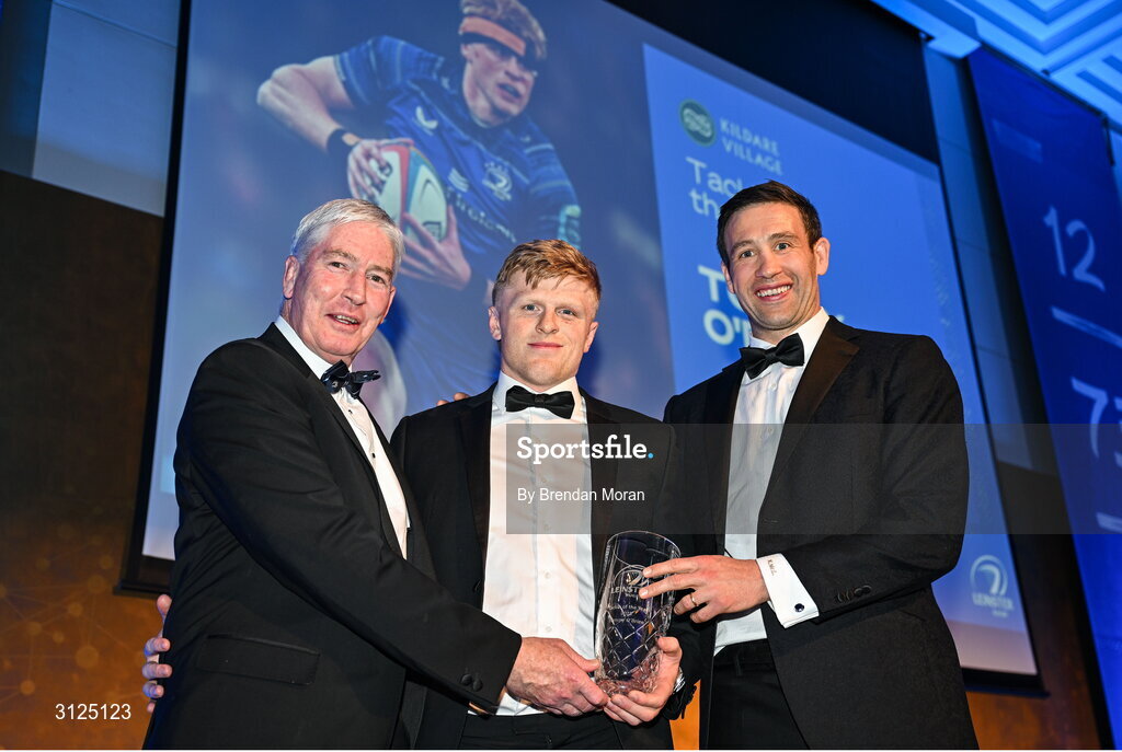 6 May 2025; Tommy O'Brien is presented with the Kildare Village Tackle of the Year award by Leinster Rugby president Declan Gardiner and Kevin McLaughlin during the Leinster Rugby awards ball 2025 at O'Reilly Hall in UCD, Dublin. Photo by Brendan Moran/Sportsfile