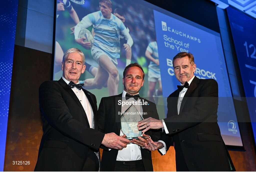 6 May 2025; Blackrock College director of rugby John Creighton is presented with the Beauchamps School of the Year award by Edward Evans of Beauchamps, right, and Leinster Rugby president Declan Gardiner during the Leinster Rugby awards ball 2025 at O'Reilly Hall in UCD, Dublin. Photo by Brendan Moran/Sportsfile