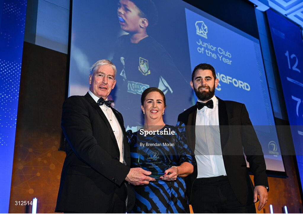 6 May 2025; Longford Rugby Club president Karen Lennon is presented with the Rhino Junior Club of the Year award by James Thornton of Rhìno, right, and Leinster Rugby president Declan Gardiner during the Leinster Rugby awards ball 2025 at O'Reilly Hall in UCD, Dublin. Photo by Brendan Moran/Sportsfile