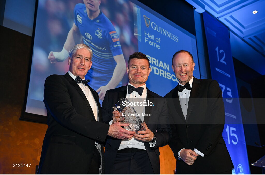 6 May 2025; Brian O'Driscoll is presented with the Guinness Hall of Fame award by Rory Sheridan of Diageo Ireland, right, and Leinster Rugby president Declan Gardiner during the Leinster Rugby awards ball 2025 at O'Reilly Hall in UCD, Dublin. Photo by Brendan Moran/Sportsfile