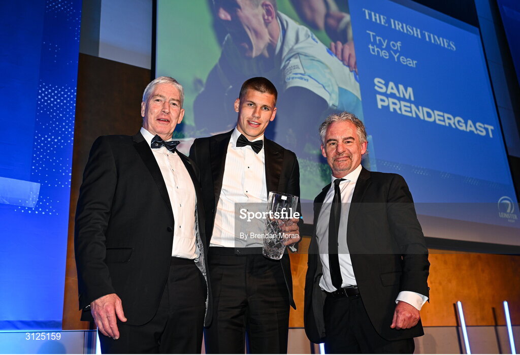 6 May 2025; Sam Prendergast is presented with the Irish Times Try of the Year award by Gerry Thornley of The Irish Times, right, and Leinster Rugby president Declan Gardiner during the Leinster Rugby awards ball 2025 at O'Reilly Hall in UCD, Dublin. Photo by Brendan Moran/Sportsfile