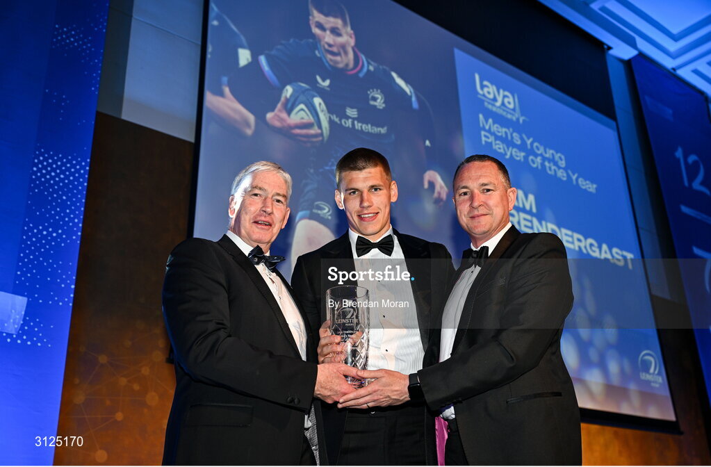 6 May 2025; Sam Prendergast is presented with the Laya Healthcare Men’s Young Player of the Year award by D.O. O'Connor of Laya Healthcare, right, and Leinster Rugby president Declan Gardiner during the Leinster Rugby awards ball 2025 at O'Reilly Hall in UCD, Dublin. Photo by Brendan Moran/Sportsfile