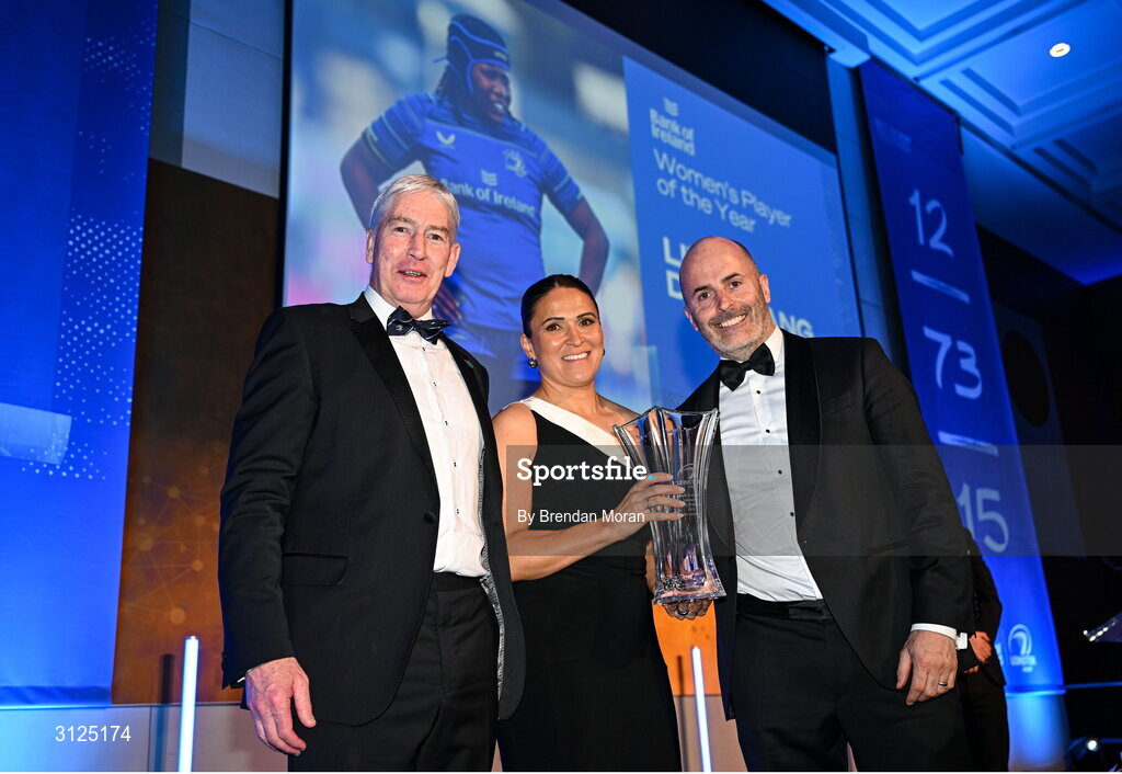 6 May 2025; Tania Rosser, is presented with the Bank of Ireland Women’s Player of the Year award on behalf of Linda Djougang, by Dave Moore of Bank of Ireland, right, and Leinster Rugby president Declan Gardiner during the Leinster Rugby awards ball 2025 at O'Reilly Hall in UCD, Dublin. Photo by Brendan Moran/Sportsfile