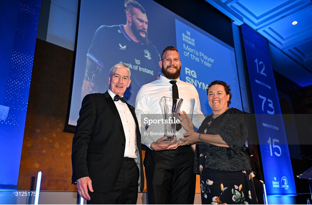 6 May 2025; RG Snyman is presented with the Bank of Ireland Men’s Player’s Player of the Year award by Paula Murphy of Bank of Ireland, right, and Leinster Rugby president Declan Gardiner during the Leinster Rugby awards ball 2025 at O'Reilly Hall in UCD, Dublin. Photo by Brendan Moran/Sportsfile